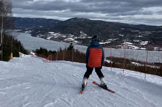 a person skiing on the snow